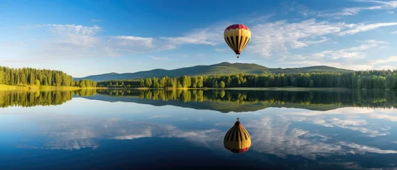 Foto op Plexiglas landscape view of colorful hot air balloons floating in the air and reflecting on the surface of a calm lake with green hills and clear blue sky in the background created with Generative AI Technology © AstraNova