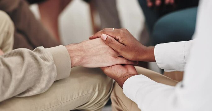 People, holding hands and closeup in group therapy with circle, comfort and kindness for mental health. Men, women and empathy for compassion, help and psychology with trust, consulting or community