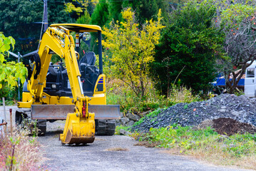 Construction yellow excavator at a construction site.