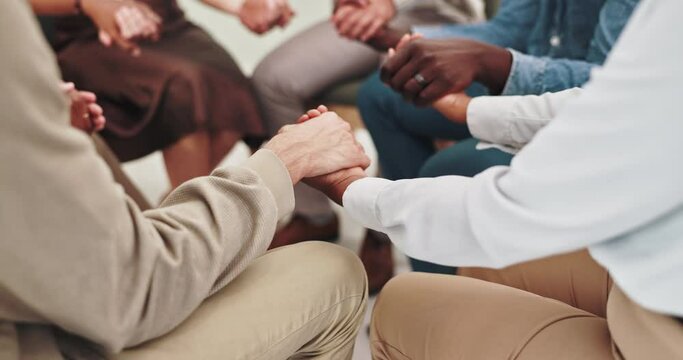 People, holding hands and together in group therapy with circle, praying or kindness for mental health. Men, women and empathy for compassion, help and psychology with trust, consulting or community