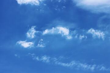 Clear blue sky with clouds background