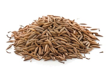 A pile of cumin on a white background. The seeds are brown and scattered. Concept of abundance and natural beauty