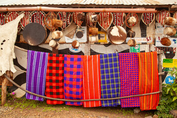 A display of colorful blankets hangs on a line for sale in Kenya.