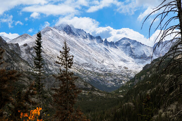 Early fall, snow-dusted peaks and forested valleys on the hike to Dream Lake, Rocky Mountain...
