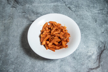 Hot Spicy pasta served in plate isolated on background top view of fast food Italian cousin