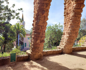 Photo of a beautiful stone walkway inside the park Guell in Carmel Hill, Barcelona, Spain.