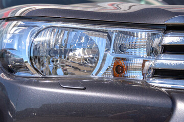 Headlight of an expensive off-road car close-up