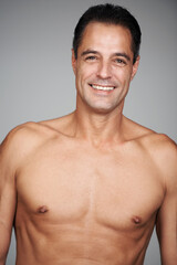 Fototapeta premium Man, shirtless and smile for strength, strong and health for growth and development in body. Mature person and happy with confidence for chest, muscular and masculine for wellness, fit and care