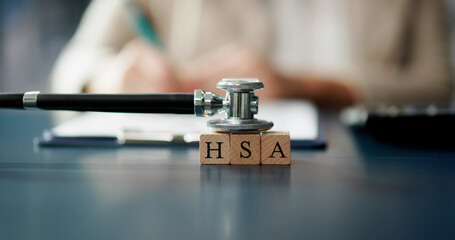 HSA Health Savings Account Wooden Blocks Near Stethoscope
