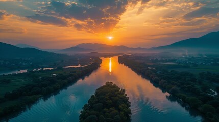 A serene nature landscape at sunrise, viewed from above by a drone
