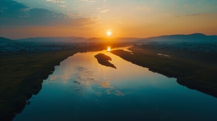 A serene nature landscape at sunrise, viewed from above by a drone