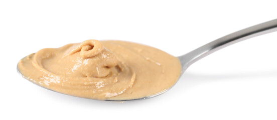 Delicious nut butter in spoon isolated on white
