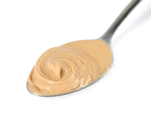 Delicious nut butter in spoon isolated on white