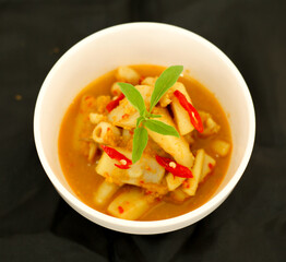 Top view. Selective focus. Cumi Rica Rica, squid cuisine with red and spicy sambal. Indonesian food.
