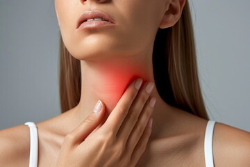 Endocrine system. Woman suffering from pain in thyroid gland on grey background, closeup