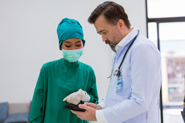 professional surgical doctor team discussing during the conference, Health check support for before treat patients on entrance operating room