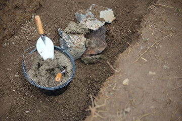 shovel and stones of ground breaking ceremonial