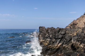 Fototapeta na wymiar Rock and waves on an empty coast in Gran Canaria, Spain