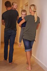 Night, mom or father carrying kids in a house or family home walking to bedroom with love and care. Dad, mother or back of parents with children to prepare and get ready for sleep or bedtime together