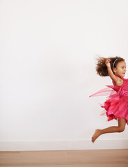 Girl, space or child in costume running with confidence, wellness or fairy outfit on wall...