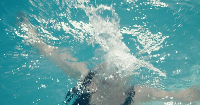 Woman swimmer smile dive underwater swimming pool water in close up