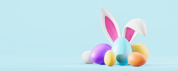 Colorful easter eggs with bunny ears on empty blue background