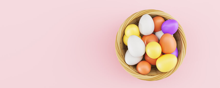 Colorful easter eggs in a basket on empty pink background