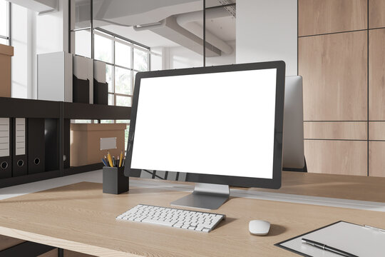 Modern business interior with pc computer on table with mockup screen