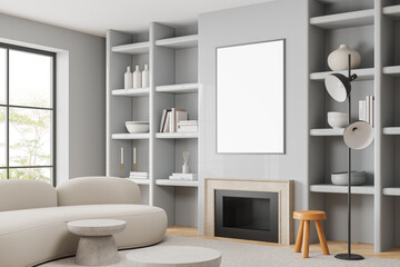 Gray living room corner with couch and poster
