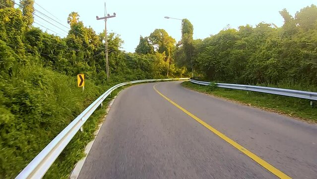 January 14, 2024 - Rawai, Phuket Thailand. Driving through Rawai and up to Windmill View Point just before sunset.