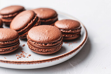 Obraz na płótnie Canvas delicious Chocolate Macarons a plate of delicate chocolate macarons
