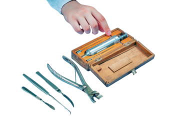 Ancient hospital for treatment soldiers on battlefield - 18th or 19th century, isolated on a white background. Forceps, syringe, scissors, scalpel and other medical instruments