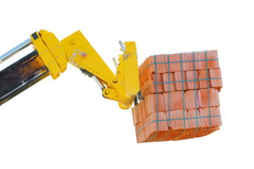 Supply packing bricks crane on the unfinished building, isolated on a white background