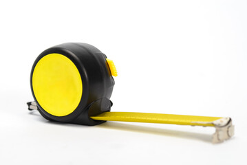Yellow retractable metal tape meter on white background.