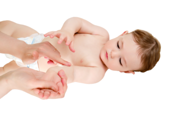 The mother smears the hand of the toddler baby boy with cosmetic cream, isolated on a white background. Mom hands apply cream to the child skin, isolated on a white background. Kid aged one year