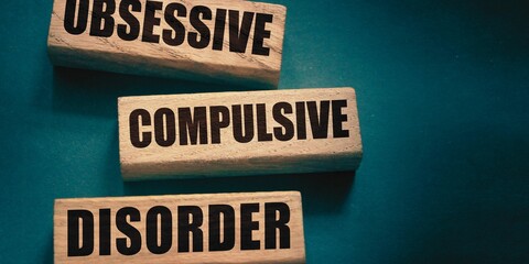 obssive compulsive disorder word made with building blocks. Wooden Blocks with the text: obessive compulsive disorder. The text is written in black letters.
