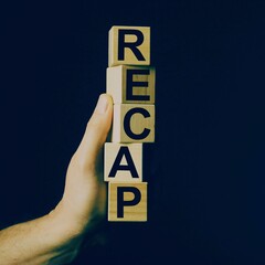 wooden blocks in a blue background with the text 'Recap"