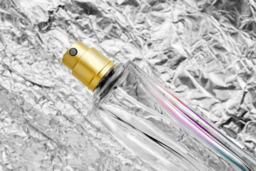 Perfume on foil background