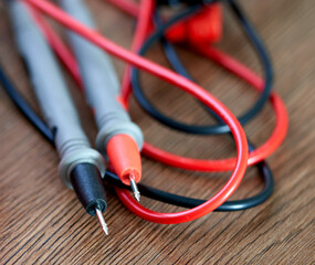 A screwdriver lies on a multimeter measuring device