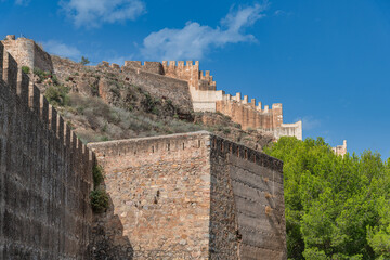 Sagunt, Valencia - Spain - View of the castle in Sagunt, showcasing thick walls, a large gate, partially ruined buildings and foundations