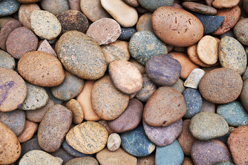 Fototapeta na wymiar Size, shape and color mixture of nature pebbles.