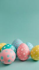 Fototapeta na wymiar Easter eggs adorned with playful polka dots on teal background 