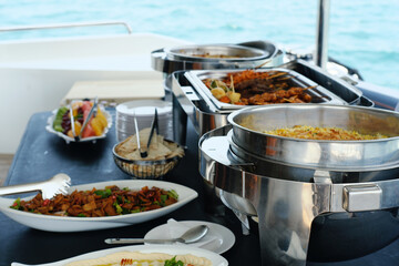 Gourmet Buffet Spread on a Yacht Cruise. A delicious buffet spread on a yacht with an array of...