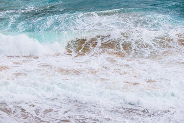Turquoise Serenity: Waves Whispering to the Shoreline
