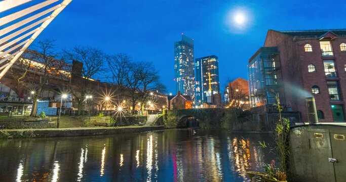 Castlefield Time lapse video showing Manchester skyline with a moon, trams and trains moving fats in and out of city centre. 