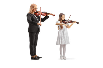 Woman and a little girl playing violins