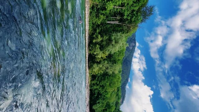 The Bolshaya Laba River. A mountain emerald river in a narrow, sunlit canyon. Bolshaya Laba River near the village of Psemen in Karachay-Cherkessia, Russia. Panoramic view. 4K