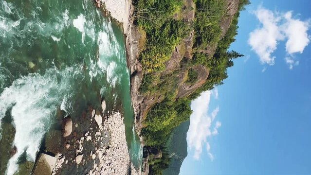 The Bolshaya Laba River. A mountain emerald river in a narrow, sunlit canyon. Bolshaya Laba River near the village of Psemen in Karachay-Cherkessia, Russia. Panoramic view. 4K