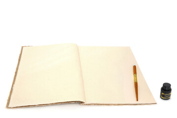 Hemp notebook with retro pen on white background. Old fashioned stationery writing equipment letter, document, journal, manuscript concept.