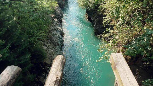 The Bolshaya Laba River. A mountain emerald river in a narrow, sunlit canyon. Bolshaya Laba River near the village of Psemen in Karachay-Cherkessia, Russia. Panoramic view. 4K